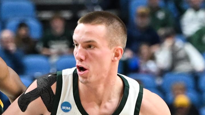 Mar 19, 2026; Buffalo, NY, USA; Michigan State Spartans guard Denham Wojcik (10) dribbles against North Dakota State Bison guard Damari Wheeler-Thomas (1) during the second half during a first round game of the men's 2026 NCAA Tournament at Keybank Center.