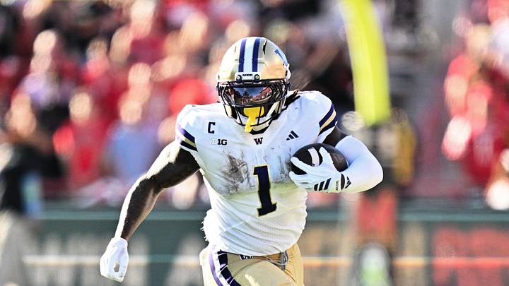 Oct 4, 2025; College Park, Maryland, USA; Washington Huskies running back Jonah Coleman (1) carries the ball against the Maryland Terrapins at SECU Stadium. Oct 4, 2025; College Park, Maryland, USA; Washington Huskies running back Jonah Coleman (1) carries the ball against the Maryland Terrapins at SECU Stadium.