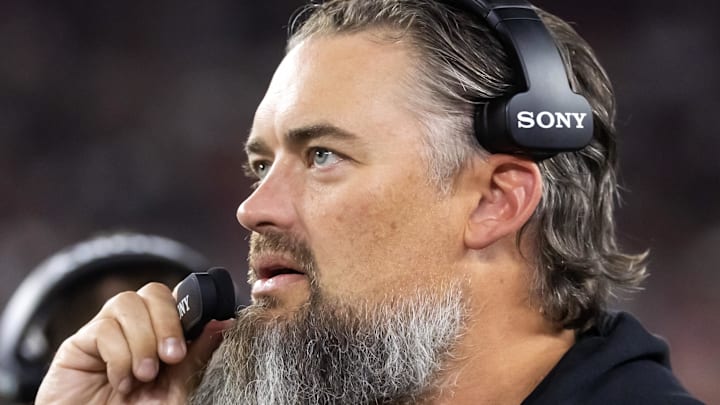 Aug 23, 2025; Glendale, Arizona, USA; Las Vegas Raiders offensive line coach Brennan Carroll against the Arizona Cardinals during a preseason NFL game at State Farm Stadium. Mandatory Credit: Mark J. Rebilas-Imagn Images