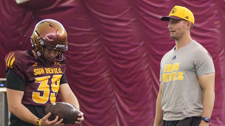 Special Teams Coordinator Jack Nudo works with kickers during practice at the Kajikawa Practice fields on Nov. 11, 2025, in Tempe, Arizona