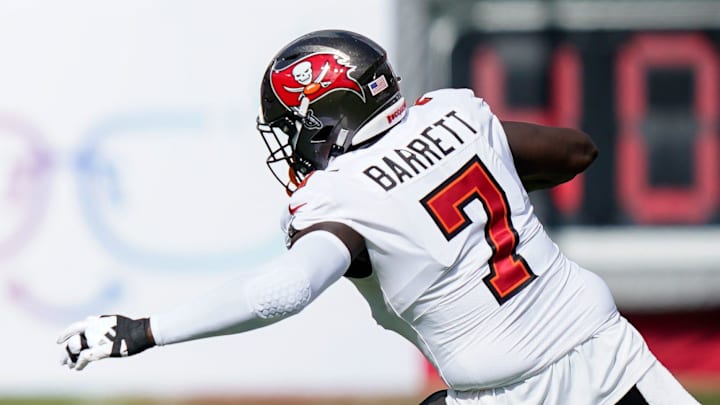 Tennessee Titans wide receiver Chris Moore (11) runs the ball past Tampa Bay Buccaneers linebacker Shaquil Barrett (7) during the first quarter at Raymond James Stadium in Tampa, Fla., Sunday, Nov. 12, 2023. Tennessee Titans wide receiver Chris Moore (11) runs the ball past Tampa Bay Buccaneers linebacker Shaquil Barrett (7) during the first quarter at Raymond James Stadium in Tampa, Fla., Sunday, Nov. 12, 2023.