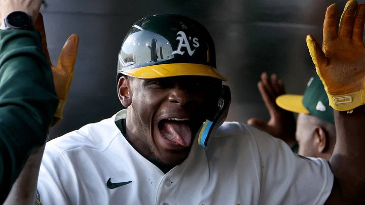 Apr 14, 2026; West Sacramento, California, USA; Athletics center fielder Denzel Clark (1) reacts in the dugout after scoring a run against the Texas Rangers during the third inning at Sutter Health Park. Mandatory Credit: Dennis Lee-Imagn Images