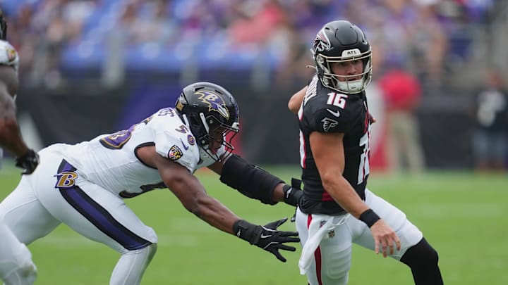 Aug 17, 2024; Baltimore, Maryland, USA; Atlanta Falcons quarterback John Paddock (16) defended during the fourth quarter by Baltimore Ravens linebacker Deion Jennings (56) at M&T Bank Stadium.