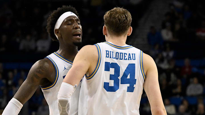 Mar 3, 2026; Los Angeles, California, USA; UCLA Bruins forward Tyler Bilodeau (34) chest dumps teammate Eric Dailey Jr. (3) after hitting a 3-point shot during the second} half at Pauley Pavilion presented by Wescom Financial. Mandatory Credit: Robert Hanashiro-Imagn Images