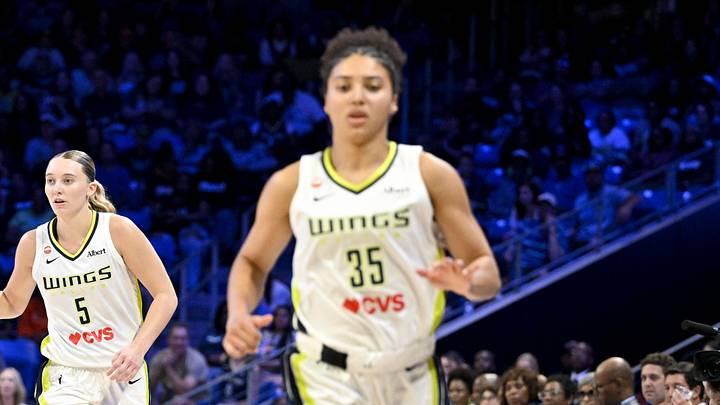 Dallas Wings guard Paige Bueckers (5) brings the ball up court behind guard Azzi Fudd (35) Dallas Wings guard Paige Bueckers (5) brings the ball up court behind guard Azzi Fudd (35)