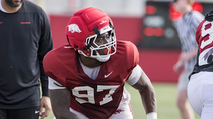 Apr 2, 2026; Fayetteville, AR, USA;  Arkansas Razorbacks defensive lineman Quincy Rhodes (97) runs a drill during spring practice at the Arkansas Razorbacks practice facilities. Mandatory Credit: Brett Rojo-Imagn Images