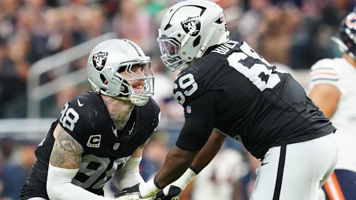 Sep 28, 2025; Paradise, Nevada, USA; Las Vegas Raiders defensive end Maxx Crosby (98) celebrates a play with defensive tackle Adam Butler (69) during the second half against the Chicago Bears at Allegiant Stadium. Mandatory Credit: Stephen R. Sylvanie-Imagn Images Sep 28, 2025; Paradise, Nevada, USA; Las Vegas Raiders defensive end Maxx Crosby (98) celebrates a play with defensive tackle Adam Butler (69) during the second half against the Chicago Bears at Allegiant Stadium. Mandatory Credit: Stephen R. Sylvanie-Imagn Images