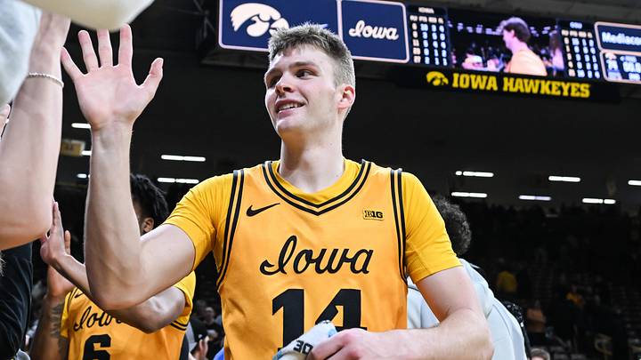 Feb 25, 2026; Iowa City, Iowa, USA; Iowa Hawkeyes guard Bennett Stirtz (14) reacts with fans after the game against the Ohio State Buckeyes at Carver-Hawkeye Arena. Mandatory Credit: Jeffrey Becker-Imagn Images