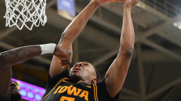 Feb 4, 2026; Seattle, Washington, USA; Iowa Hawkeyes forward Cam Manyawu (3) shoots the ball over Washington Huskies center Franck Kepnang (11) during the second half at Alaska Airlines Arena at Hec Edmundson Pavilion. Mandatory Credit: Steven Bisig-Imagn Images