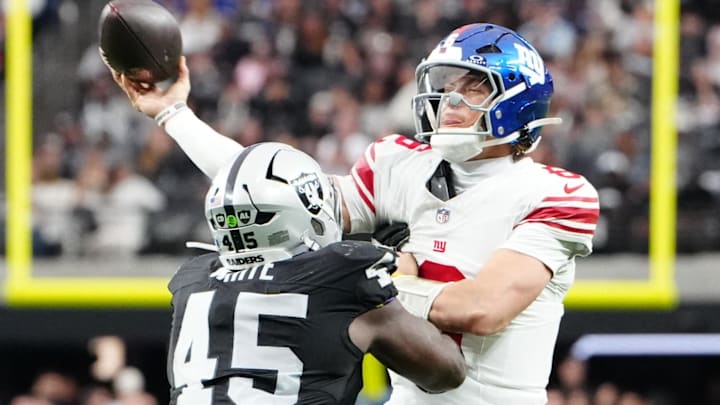 Dec 28, 2025; Paradise, Nevada, USA; New York Giants quarterback Jaxson Dart (6) throws while under pressure from Las Vegas Raiders linebacker Devin White (45) in the second quarter at Allegiant Stadium. Mandatory Credit: Stephen R. Sylvanie-Imagn Images