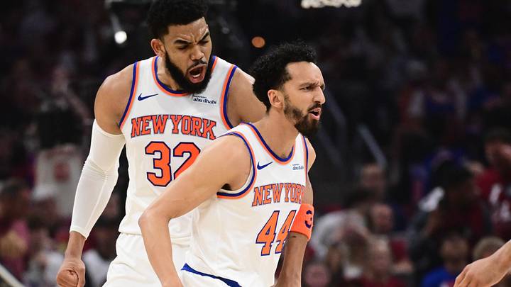 New York Knicks center Karl-Anthony Towns (32) celebrates a shot made by guard Landry Shamet (44) in the second quarter against the Cleveland Cavaliers during game four of the eastern conference finals for the 2026 NBA playoffs at Rocket Arena.