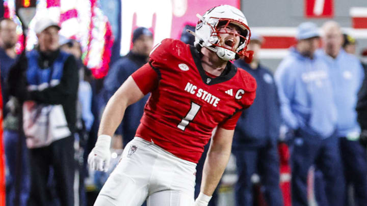 Nov 29, 2025; Raleigh, North Carolina, USA; NC State Wolfpack linebacker Caden Fordham (1) reacts to his tackle during the first half of the game against North Carolina Tar Heels at Carter-Finley Stadium.  Mandatory Credit: Jaylynn Nash-Imagn Images