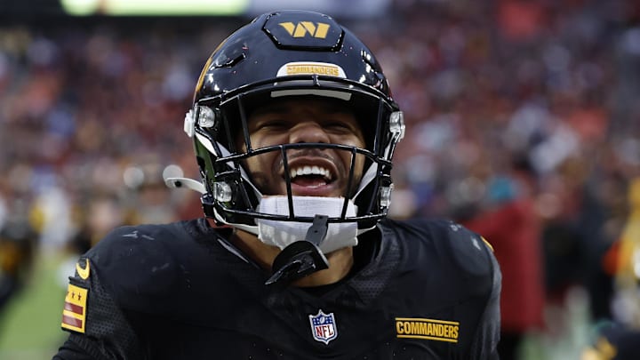 Dec 1, 2024; Landover, Maryland, USA; Washington Commanders running back Chris Rodriguez Jr. (36) celebrates after scoring a touchdown against the Tennessee Titans during the fourth quarter at Northwest Stadium. Mandatory Credit: Geoff Burke-Imagn Images