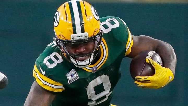 Green Bay Packers running back Josh Jacobs breaks a tackle during the game against the Bengals. Green Bay Packers running back Josh Jacobs breaks a tackle during the game against the Bengals.