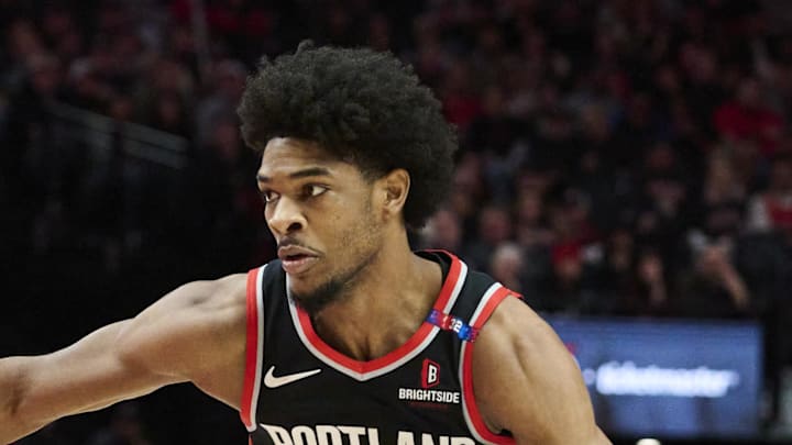 Jan 19, 2025; Portland, Oregon, USA; Portland Trail Blazers guard Scoot Henderson (00) drives to the basket during the second half against Chicago Bulls forward Patrick Williams (44) at Moda Center. Mandatory Credit: Troy Wayrynen-Imagn Images