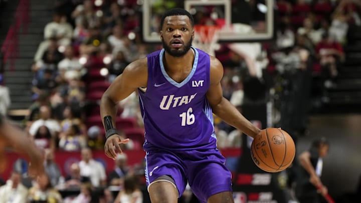 Jul 14, 2025; Las Vegas, NV, USA;  Utah Jazz guard Elijah Harkless (16) dribbles the ball against the San Antonio Spurs during the first half of a NBA basketball game at the Thomas & Mack Center. Mandatory Credit: Lucas Peltier-Imagn Images