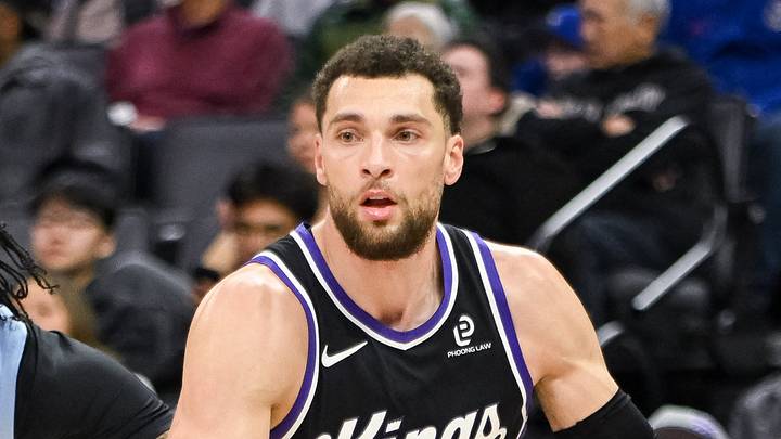 Feb 4, 2026; Sacramento, California, USA; Sacramento Kings guard Zach LaVine (8) dribbles past Memphis Grizzlies guard Kentavious Caldwell-Pope (3) during the third quarter at Golden 1 Center. Mandatory Credit: Ed Szczepanski-Imagn Images