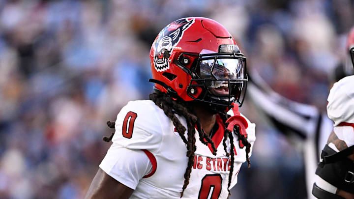 Nov 30, 2024; Chapel Hill, North Carolina, USA; North Carolina State Wolfpack linebacker Sean Brown (0) reacts after recovering a fumble in the first quarter at Kenan Memorial Stadium. Mandatory Credit: Bob Donnan-Imagn Images Nov 30, 2024; Chapel Hill, North Carolina, USA; North Carolina State Wolfpack linebacker Sean Brown (0) reacts after recovering a fumble in the first quarter at Kenan Memorial Stadium. Mandatory Credit: Bob Donnan-Imagn Images