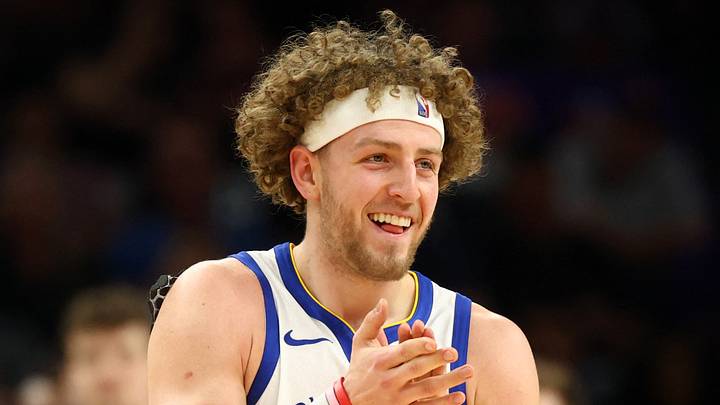 Apr 17, 2026; Phoenix, Arizona, USA; Golden State Warriors guard Brandin Podziemski (2) celebrates against the Phoenix Suns during the first half in the play-in rounds of the 2026 NBA Playoffs at Mortgage Matchup Center. Mandatory Credit: Mark J. Rebilas-Imagn Images