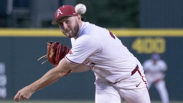 Arkansas Razorbacks pitcher Zach Root throws a pitch against the Texas Longhorns. The Razorbacks blanked the Longhorns 9-0 in the series opener. Arkansas Razorbacks pitcher Zach Root throws a pitch against the Texas Longhorns. The Razorbacks blanked the Longhorns 9-0 in the series opener.
