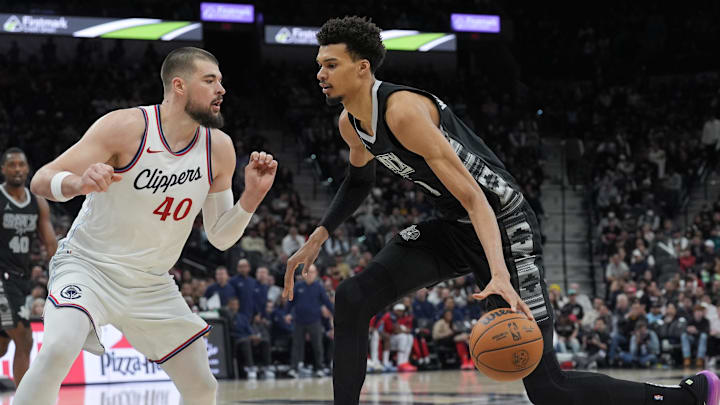Jan 29, 2025; San Antonio, Texas, USA; San Antonio Spurs center Victor Wembanyama (1) dribbles against LA Clippers center Ivica Zubac (40) in the second half at Frost Bank Center. Jan 29, 2025; San Antonio, Texas, USA; San Antonio Spurs center Victor Wembanyama (1) dribbles against LA Clippers center Ivica Zubac (40) in the second half at Frost Bank Center.