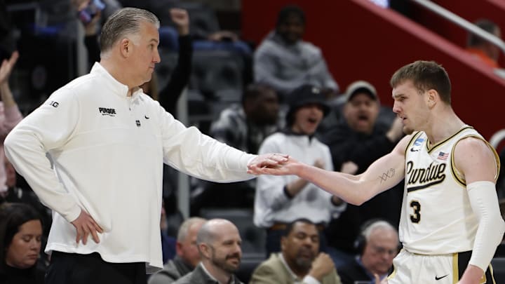 Purdue Boilermakers guard Braden Smith (3) bumps fist with head coach Matt Painter