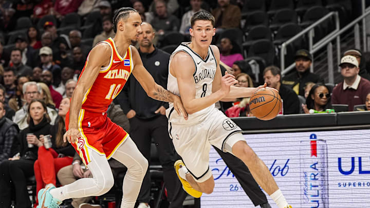 Feb 22, 2026; Atlanta, Georgia, USA; Brooklyn Nets guard Egor Demin (8) dribbles against Atlanta Hawks forward Zaccharie Risacher (10) during the first half at State Farm Arena. Mandatory Credit: Dale Zanine-Imagn Images
