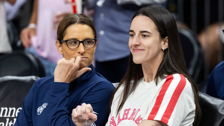 Aug 7, 2025; Phoenix, Arizona, USA; Indiana Fever injured guard Caitlin Clark (right) with head coach Stephanie White against the Phoenix Mercury during an WNBA game at PHX Arena. Mandatory Credit: Mark J. Rebilas-Imagn Images