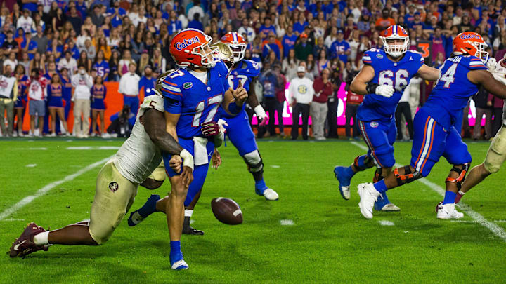 Florida State Seminoles defensive lineman Jared Verse (5) sacks Florida Gators quarterback Max Brown.