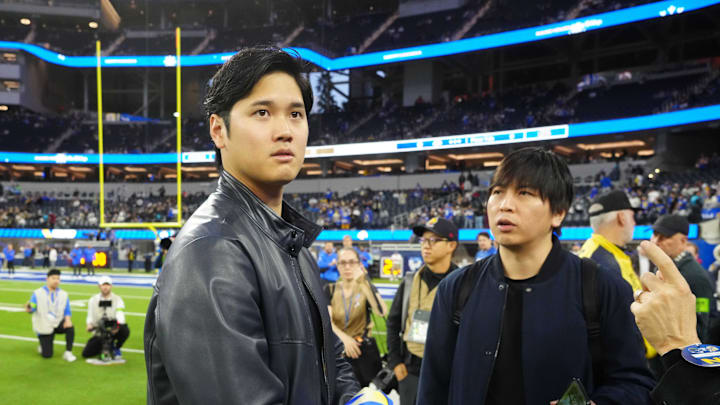 Dodgers star Shohei Ohtani (left) and interpreter Ippei Mizuhara attend the game between the Los Angeles Rams and the New Orleans Saints at SoFi Stadium on Dec. 21, 2023.