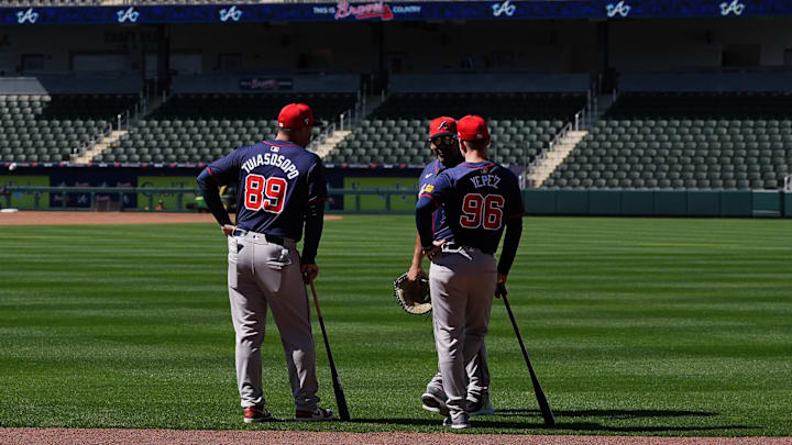 Feb 15, 2024; North Port, FL, USA;  Atlanta Braves coaches talk in the outfield at Braves Spring