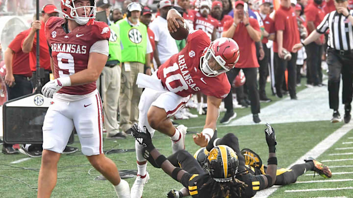 Arkansas Razorbacks quarterback Taylen Green is brought down by UAPB defenders out of bounds at War Memorial Stadium in Little Rock, Ark. Arkansas Razorbacks quarterback Taylen Green is brought down by UAPB defenders out of bounds at War Memorial Stadium in Little Rock, Ark.