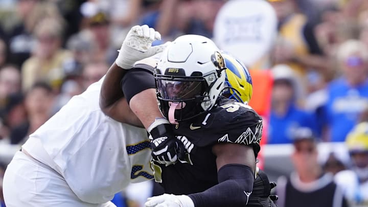 Sep 6, 2025; Boulder, Colorado, USA; Delaware Fightin Blue Hens offensive lineman Cole Snyder (77) holds Colorado Buffaloes defensive end Arden Walker (53) in the second half at Folsom Field. 