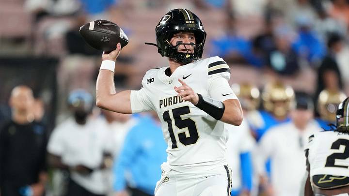 Purdue Boilermakers quarterback Ryan Browne (15) throws a 75-yard touchdown pass against the UCLA Bruins Purdue Boilermakers quarterback Ryan Browne (15) throws a 75-yard touchdown pass against the UCLA Bruins