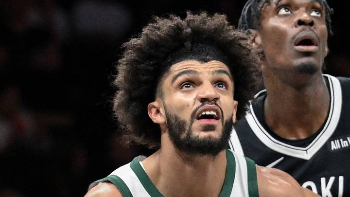 Milwaukee Bucks guard Andre Jackson Jr. boxes out Brooklyn Nets forward Trevon Scott.