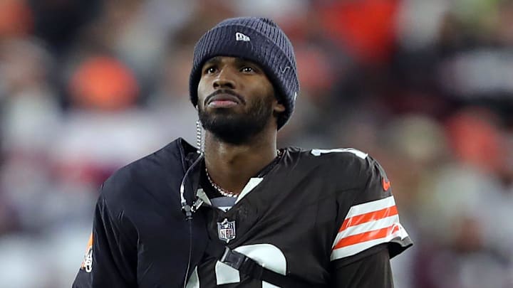 Cleveland Browns quarterback Shedeur Sanders (12) waits for his opportunity as head coach Kevin Stefanski watches Dillon Gabriel lead the offense during the first half of an NFL football game at Huntington Bank Field, Nov. 16, 2025, in Cleveland, Ohio.