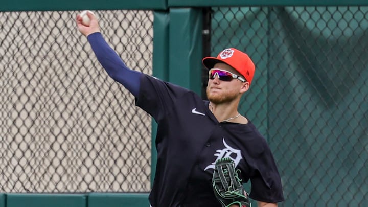 Feb 22, 2025; Lakeland, Florida, USA; Detroit Tigers outfielder Parker Meadows (22) throws to the infield during the third inning against the Philadelphia Phillies at Publix Field at Joker Marchant Stadium.