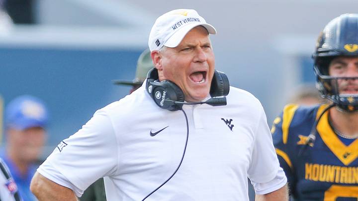 Sep 13, 2025; Morgantown, West Virginia, USA; West Virginia Mountaineers head coach Rich Rodriguez yells at the referee during the second quarter against the Pittsburgh Panthers at Milan Puskar Stadium. Mandatory Credit: Ben Queen-Imagn Images
