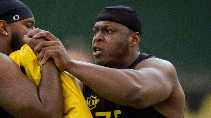 Oregon offensive lineman Emmanuel Pregnon, right, hits offensive lineman Matthew Bedford during Oregon Pro Day on March 17, 2026, at the Moshofsky Center in Eugene, Oregon.