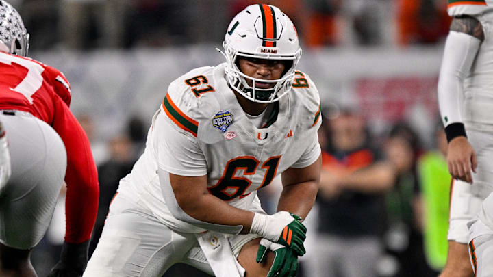 Dec 31, 2025; Arlington, TX, USA; Miami Hurricanes offensive lineman Francis Mauigoa (61) lines up during the 2025 Cotton Bowl and quarterfinal game of the College Football Playoff at AT&T Stadium.  