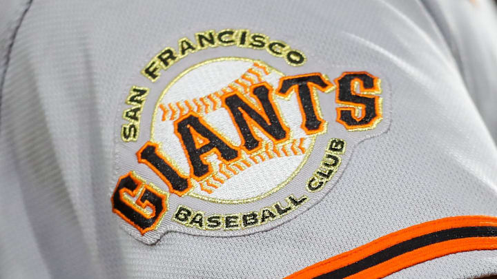 The San Francisco Giants logo on the sleeve of a player's jersey. The San Francisco Giants logo on the sleeve of a player's jersey.