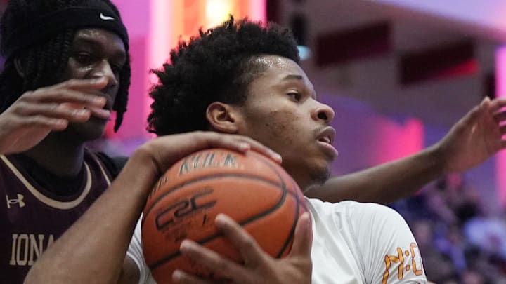 Stepinac’s Jasiah Jervis (25) tries to get around Iona Prep’s Elijah Joseph (13) during basketball action in the Crusader Classic at the Westchester County Center Jan. 3, 2026.
