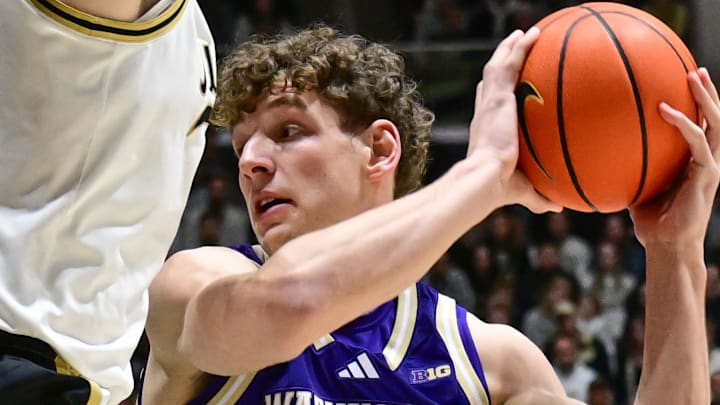 Jan 7, 2026; West Lafayette, Indiana, USA; Washington Huskies forward Hannes Steinbach (6) looks to get around Purdue Boilermakers center Oscar Cluff (45) during the first half at Mackey Arena.