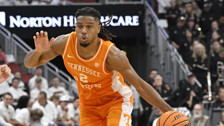 Nov 9, 2024; Louisville, Kentucky, USA;  Tennessee Volunteers guard Chaz Lanier (2) dribbles against Louisville Cardinals forward Noah Waterman (93) during the first half at KFC Yum! Center. Tennessee defeated Louisville 77-55. Mandatory Credit: Jamie Rhodes-Imagn Images
