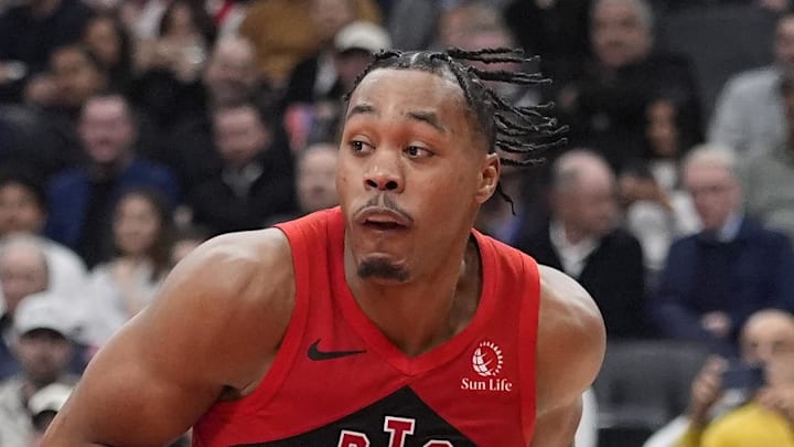 Toronto Raptors guard Scottie Barnes looks to pass the ball against the Houston Rockets. Toronto Raptors guard Scottie Barnes looks to pass the ball against the Houston Rockets.