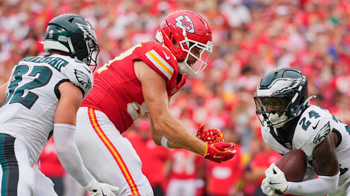 Sep 14, 2025; Kansas City, Missouri, USA; Philadelphia Eagles safety Andrew Mukuba (24) intercepts a pass intended for Kansas City Chiefs tight end Travis Kelce (87) during the fourth quarter of the game at GEHA Field at Arrowhead Stadium. Mandatory Credit: Jay Biggerstaff-Imagn Images Sep 14, 2025; Kansas City, Missouri, USA; Philadelphia Eagles safety Andrew Mukuba (24) intercepts a pass intended for Kansas City Chiefs tight end Travis Kelce (87) during the fourth quarter of the game at GEHA Field at Arrowhead Stadium. Mandatory Credit: Jay Biggerstaff-Imagn Images