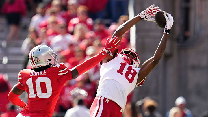 Nebraska Cornhuskers wide receiver Isaiah Neyor (18) attempts a catch behind Ohio State Buckeyes cornerback Denzel Burke (10) during the first half of the NCAA football game at Ohio Stadium in Columbus on Saturday, Oct. 26, 2024.