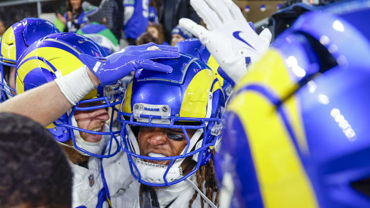 Nov 3, 2024; Seattle, Washington, USA; Los Angeles Rams wide receiver Demarcus Robinson (15, middle-right) celebrates with teammates, including wide receiver Cooper Kupp (10, left), after catching a game-wining touchdown pass against the Seattle Seahawks during overtime at Lumen Field. Mandatory Credit: Joe Nicholson-Imagn Images Nov 3, 2024; Seattle, Washington, USA; Los Angeles Rams wide receiver Demarcus Robinson (15, middle-right) celebrates with teammates, including wide receiver Cooper Kupp (10, left), after catching a game-wining touchdown pass against the Seattle Seahawks during overtime at Lumen Field. Mandatory Credit: Joe Nicholson-Imagn Images
