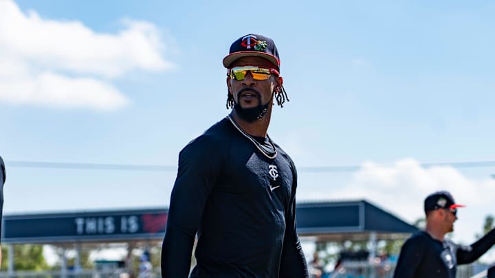 Outfielder Byron Buxton, center, heads to the dugout before batting practice during the Minnesota Twins first full-squad workout of spring training at Lee Health Sports Complex in Fort Myers, Fla., on Monday, Feb. 16, 2026.