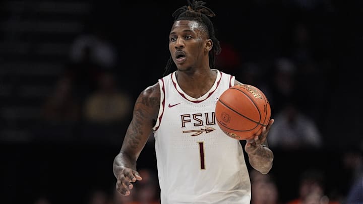 Mar 11, 2025; Charlotte, NC, USA;  Florida State Seminoles guard Jamir Watkins (1) brings the ball up court against the Syracuse Orange during the second half at Spectrum Center. Mandatory Credit: Jim Dedmon-Imagn Images